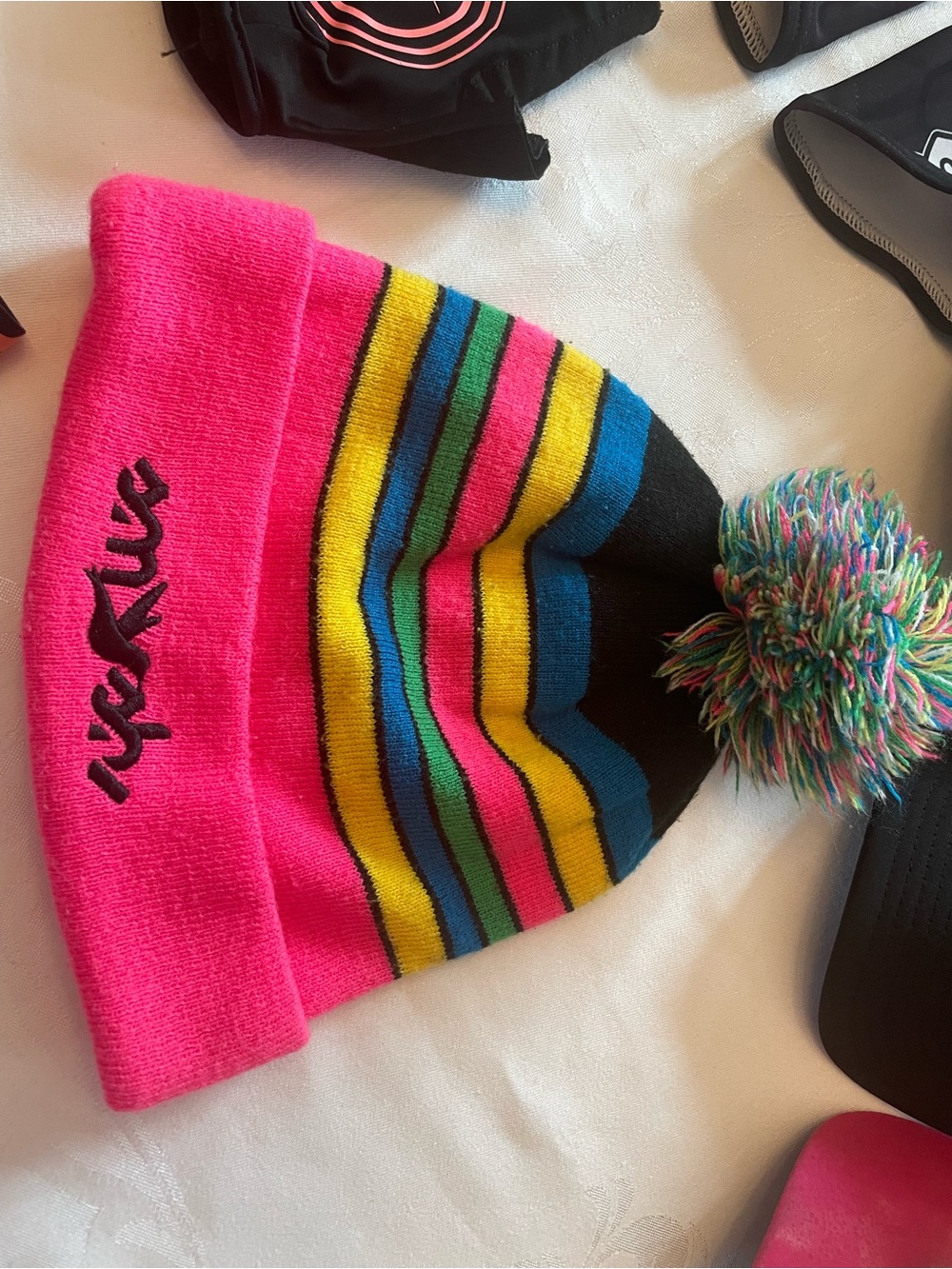 Smashfest Queen women’s Bright Pink Striped Pom Beanie Hat